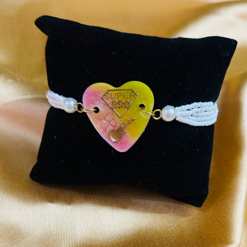 Resin Rakhi - heart with pearl bracelet